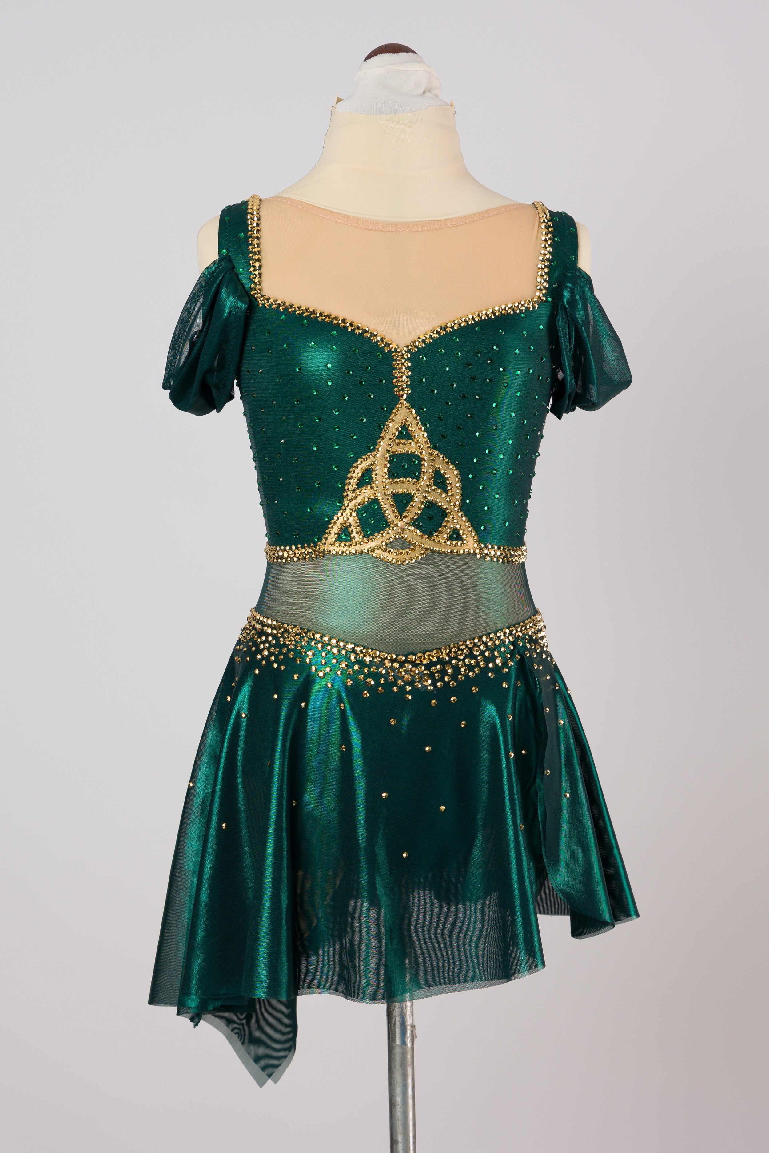 Shimmering green dress with a Celtic knot detail on the chest